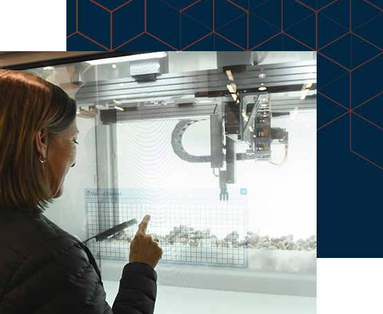 Woman pointing at plastic objects in a display