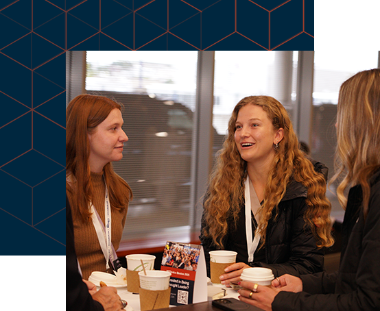 Three women engaged in conversation while enjoying coffee together