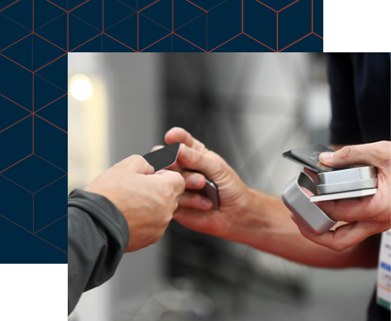 Two hands exchanging business cards