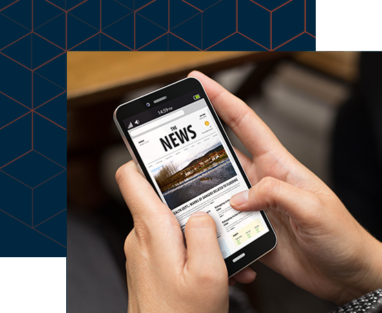 a mobile phone showing news